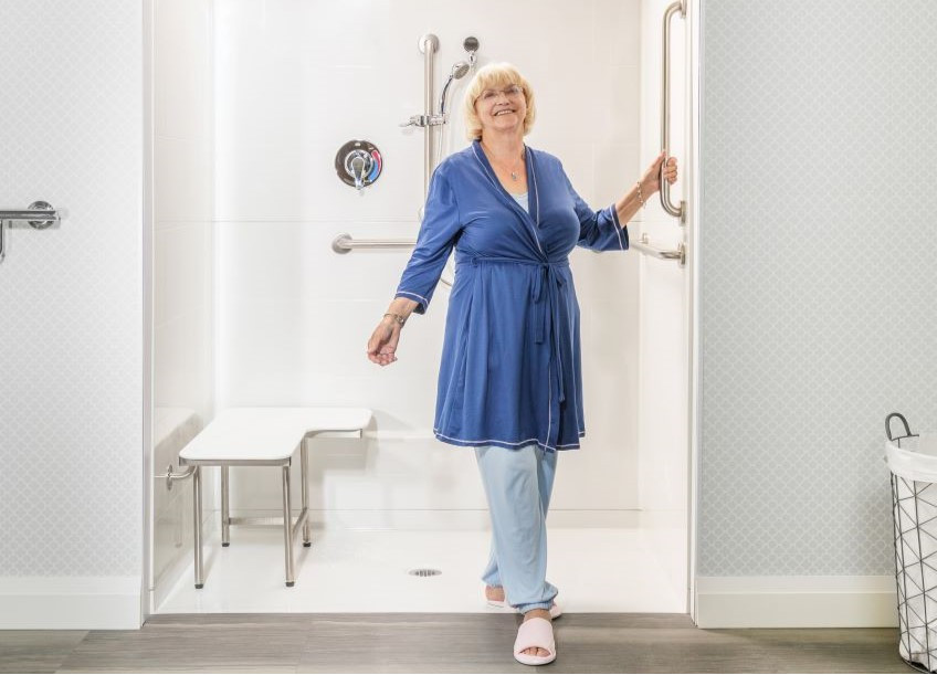 Senior in an ADA Shower in a compliant bathroom
